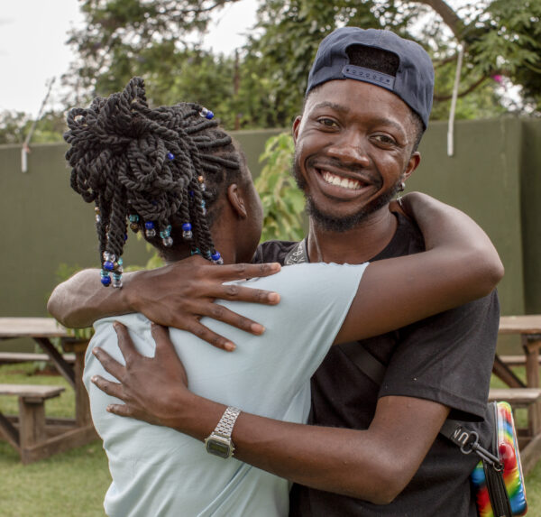 Two young people embrazing each other